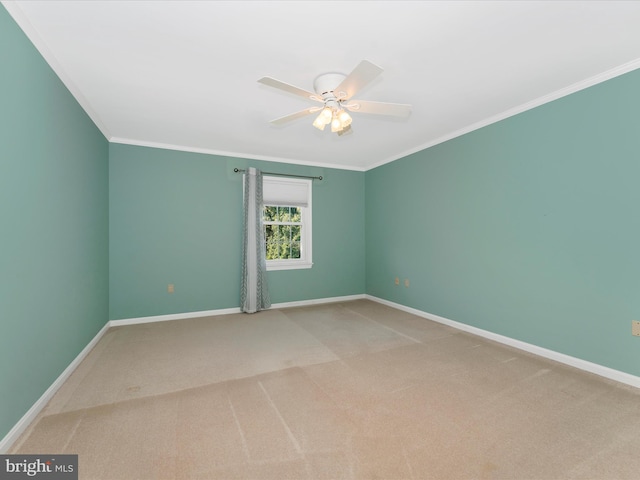 unfurnished room with crown molding, ceiling fan, and carpet floors