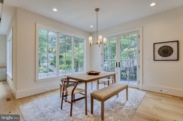 dining area featuring a healthy amount of sunlight and light wood-type flooring