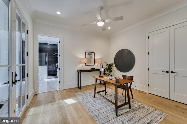 home office with french doors, ceiling fan, crown molding, and light hardwood / wood-style flooring