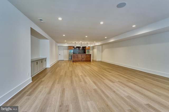 unfurnished living room with light hardwood / wood-style floors