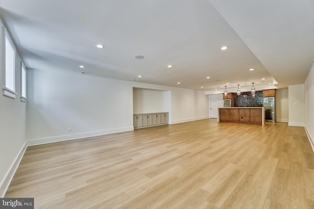 unfurnished living room featuring light wood-type flooring