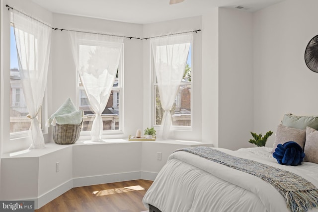 bedroom with hardwood / wood-style floors