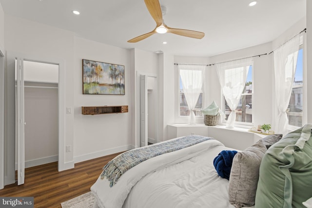 bedroom with ceiling fan and dark hardwood / wood-style floors