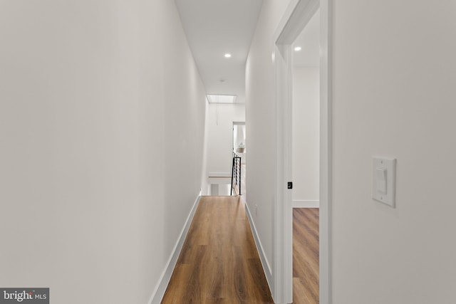 hallway featuring dark hardwood / wood-style floors