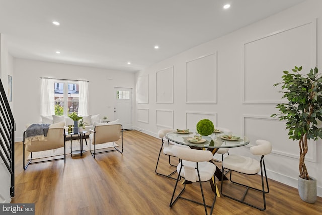 dining space featuring hardwood / wood-style flooring