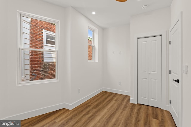 empty room with hardwood / wood-style floors