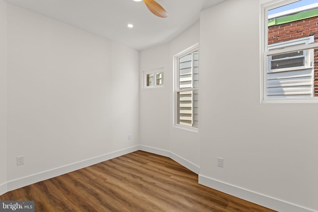 spare room with wood-type flooring and ceiling fan