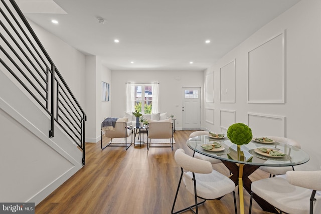 dining space with dark hardwood / wood-style floors