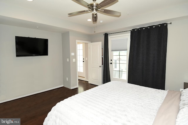 bedroom featuring ceiling fan and dark hardwood / wood-style floors