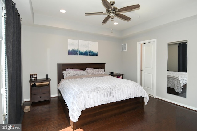 bedroom featuring ceiling fan and dark hardwood / wood-style floors