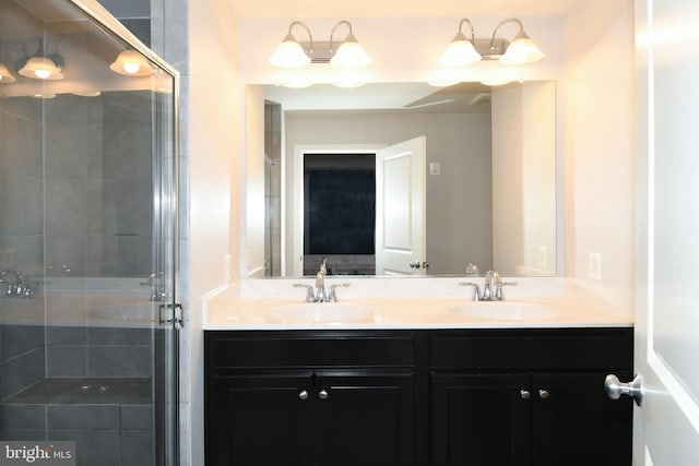 bathroom featuring vanity and an enclosed shower