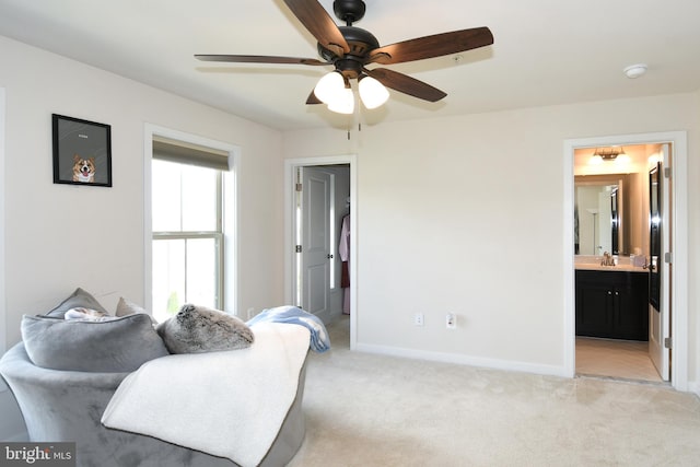 interior space featuring connected bathroom and ceiling fan