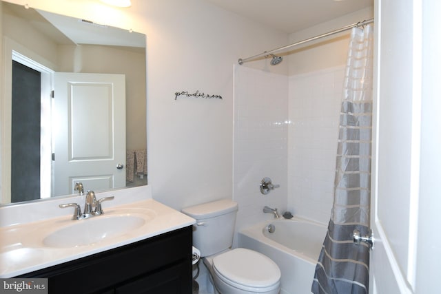 full bathroom featuring shower / bath combo with shower curtain, vanity, and toilet