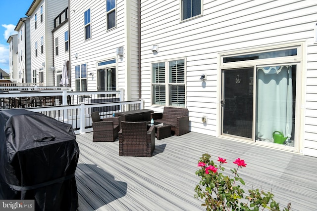 wooden deck featuring grilling area