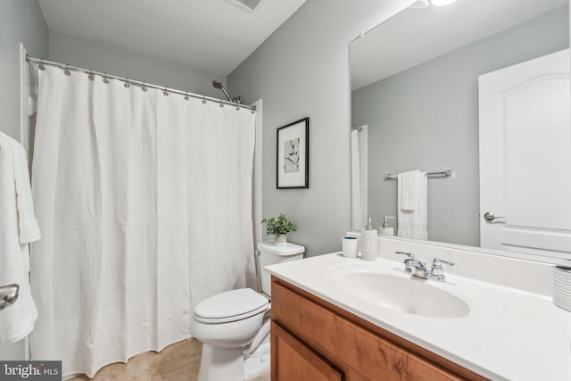 bathroom featuring vanity, a shower with shower curtain, toilet, and tile patterned floors