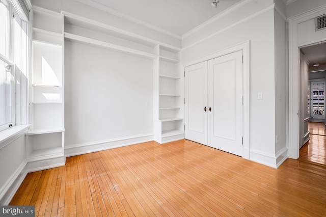 walk in closet with visible vents and light wood-type flooring