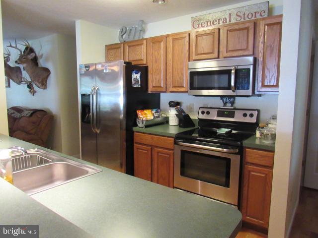 kitchen featuring stainless steel appliances and sink