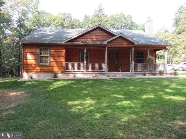 view of front facade with a porch and a front yard