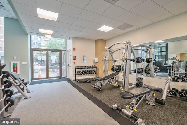 exercise room with a paneled ceiling