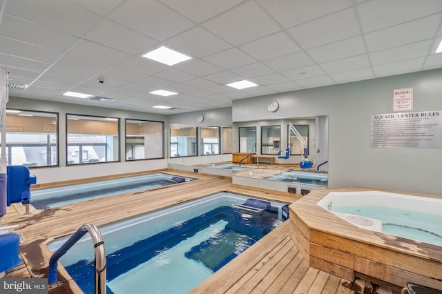 view of swimming pool featuring an indoor in ground hot tub