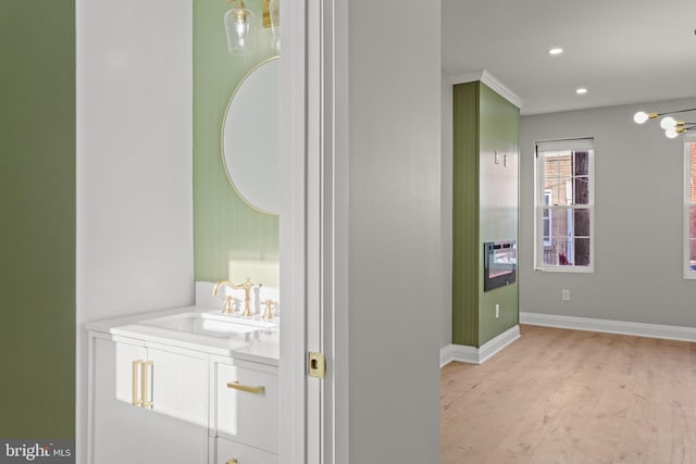 interior space with hardwood / wood-style floors and vanity