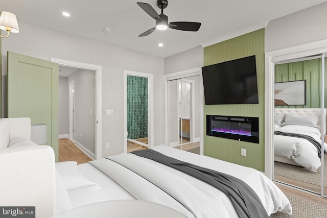 bedroom with a closet, ceiling fan, and light hardwood / wood-style flooring