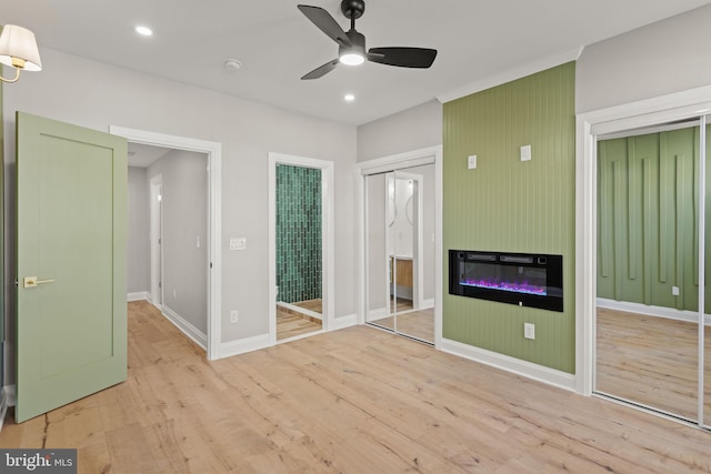 unfurnished bedroom featuring light hardwood / wood-style flooring and ceiling fan