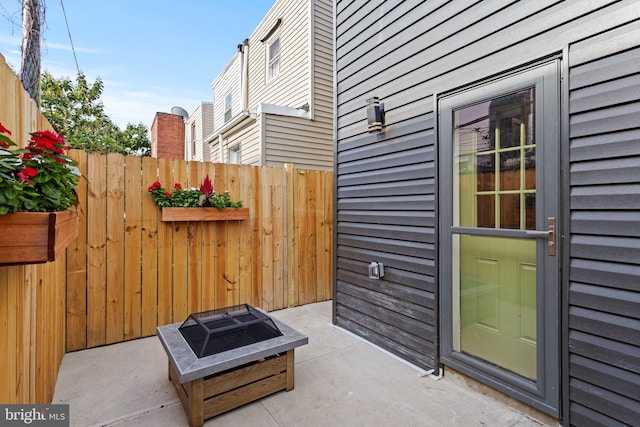 view of patio with an outdoor fire pit