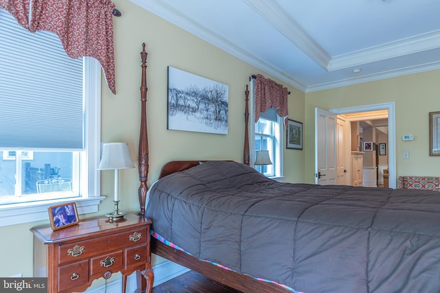 bedroom featuring hardwood / wood-style flooring and crown molding