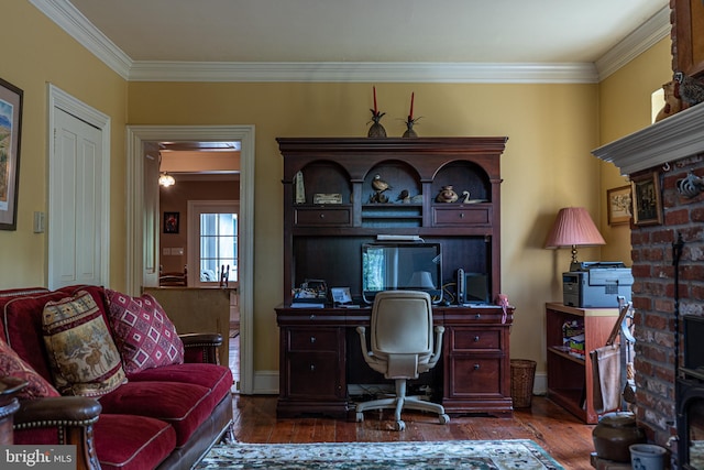 office area with ornamental molding and dark hardwood / wood-style floors