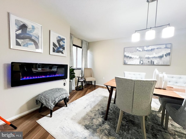 dining space featuring dark hardwood / wood-style floors