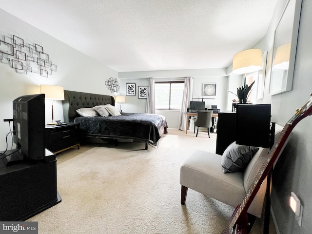 carpeted bedroom with a textured ceiling