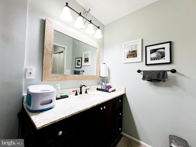 bathroom featuring vanity and a textured ceiling