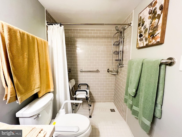 bathroom with a shower with curtain, toilet, and tile patterned floors