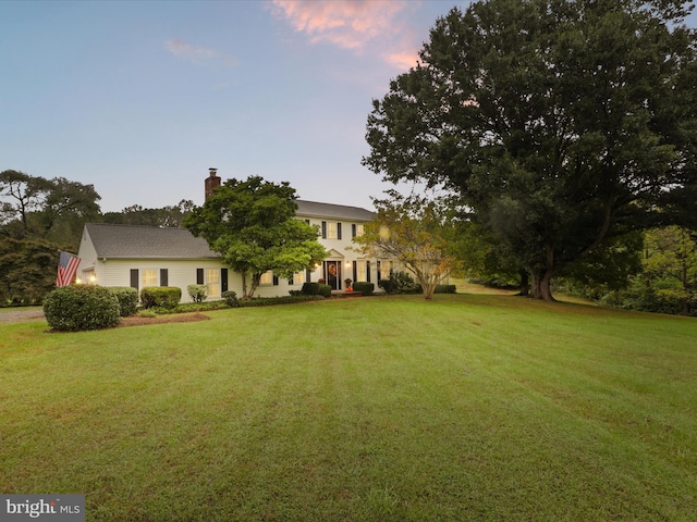 view of front of property with a lawn