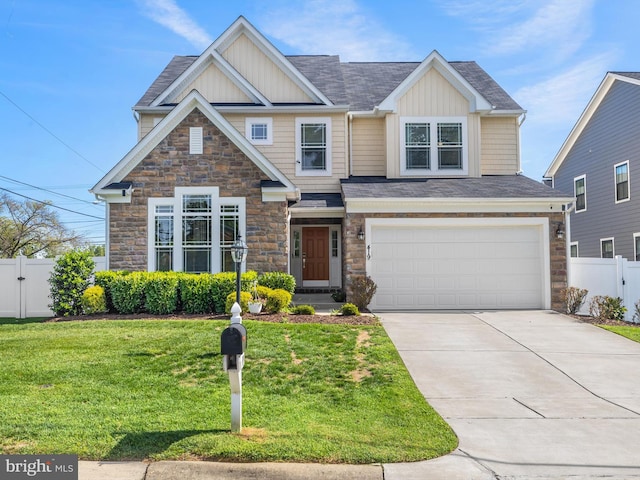 view of front of property featuring a garage and a front lawn