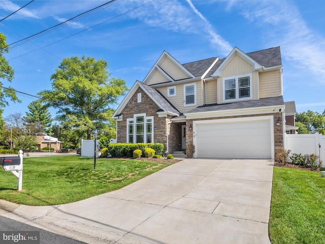 craftsman-style house with a front yard and a garage