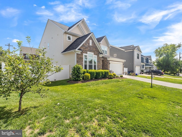 view of front of house with a garage and a front lawn