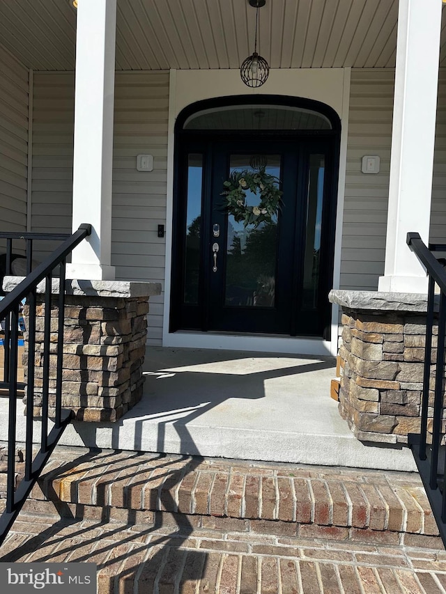 entrance to property with a porch