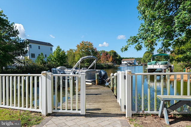 view of gate with a water view