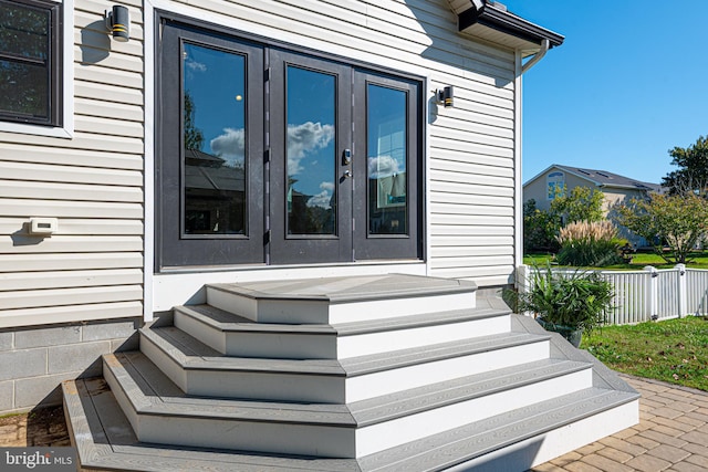 property entrance featuring french doors