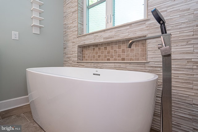 bathroom featuring a washtub