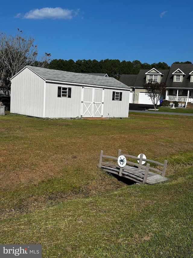 view of outdoor structure with a yard