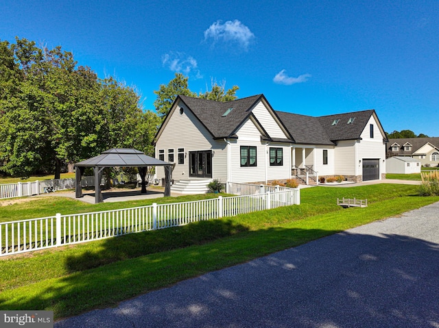 view of front of house featuring a front lawn and a gazebo