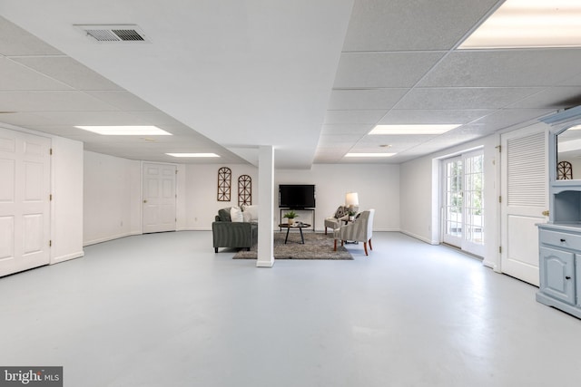 basement featuring a drop ceiling