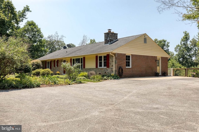 single story home featuring covered porch