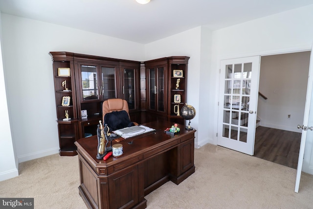 carpeted office space with french doors