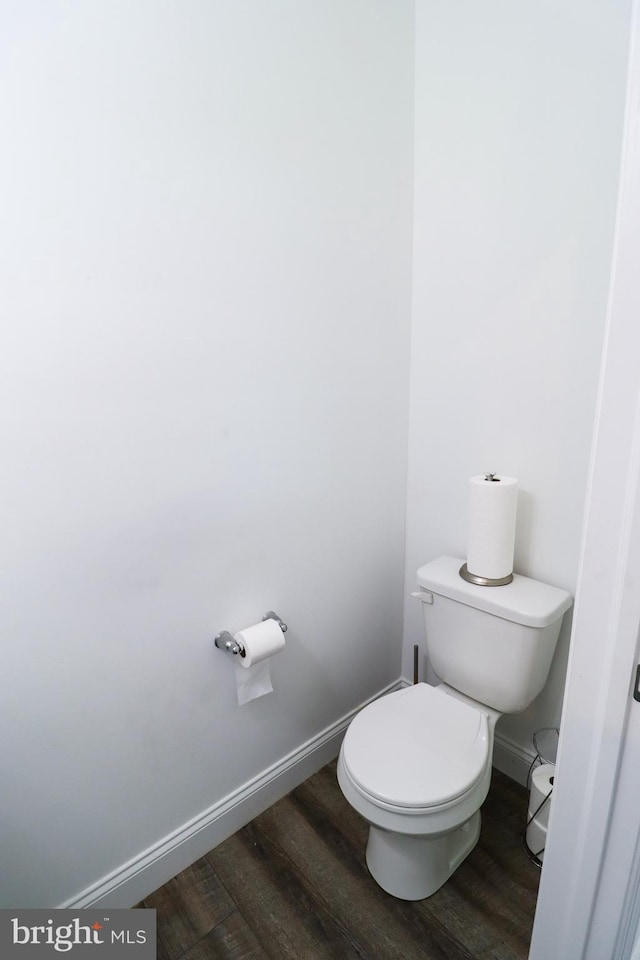 bathroom featuring toilet and hardwood / wood-style floors