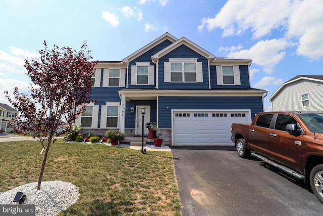 view of front of home featuring a garage and a front lawn