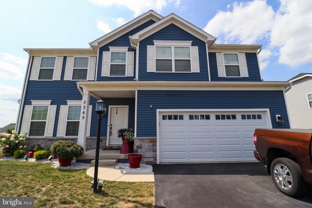 view of front of property with a garage